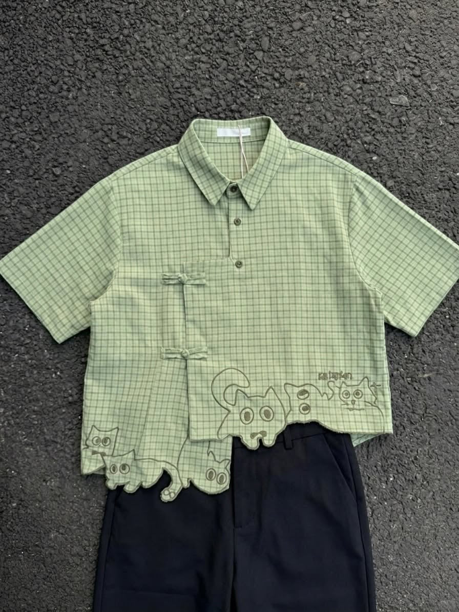 Asymmetric plaid shirt with frog closure and cat embroidery