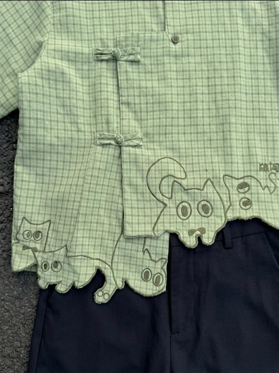 Asymmetric plaid shirt with frog closure and cat embroidery